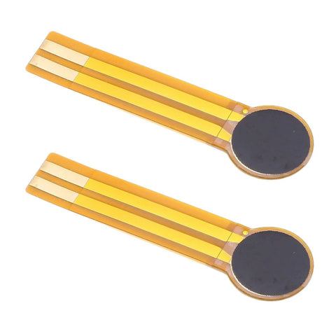 Two thin-film pressure sensors on yellow flex film with circular black sensing pads