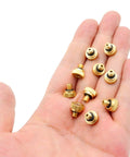 Hand holding Brass Misting Nozzle Replacement Heads 0.2mm Orifice 10/24 UNC Outdoor Cooling System, 10 Pack