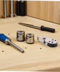 Workbench with tools and a Stainless Steel Sailing Pulley Block Set Four Pack With Bearing Wheels for smooth tension control.