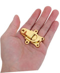 Durable Vintage Style Zinc Alloy Duckbill Toggle Latches 2 Pack Easy Operation Over Center Fasteners for Retro decorative storage cases shown in hand.