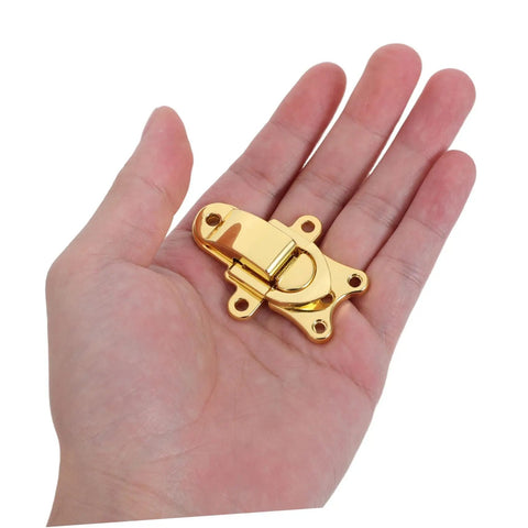 Durable Vintage Style Zinc Alloy Duckbill Toggle Latches 2 Pack Easy Operation Over Center Fasteners for Retro decorative storage cases shown in hand.