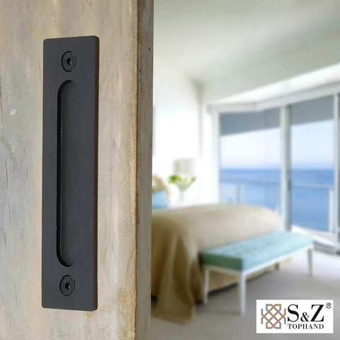 Heavy Duty 12 Inch Sliding Barn Door Handle Set In Black With Powder Coat, installed on a wood door, bedroom view