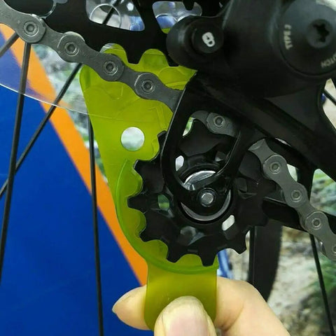 Rear Derailleur Adjuster and Chain Gap Gauge Tool for 12 Speed Eagle GX NX in use on a bike wheel with green ABS material