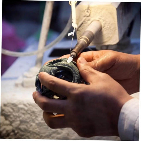 Person using Wool Felt Polishing Wheel Set With Mandrel Handle, 120 Pcs Buffing Wheels For Rotary Tool on sculpture