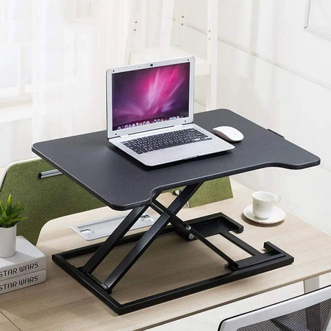 Portable Sit Stand Desk Converter With Heavy Duty Dual Tray Ergonomic Stand on a desk, holding a laptop and mouse.