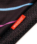 Close-up of Miloto black fabric with multicolor lines and red tag