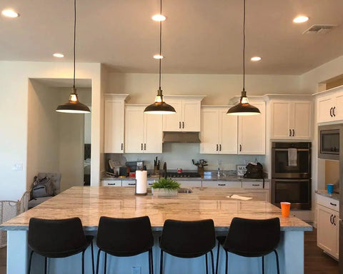 Kitchen with Dope Black Industrial Pendant Lights 3 Pack, Barn Shade Bar Kitchen Island Lighting above marble countertop and stools.