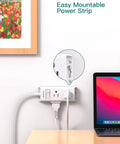 Slim Flat Plug Extension Cord With Six Outlets And Right Angle Design Gonna Save You Serious Space Behind Sofas Beds Or Fridges Perfect For Dorms Tiny Spots Keeps Your Gear Running Butter Smooth All Day Long, mounted on wall next to a laptop.