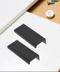 Slick Matte Black Recessed Cabinet Handles Edge Pulls for Sliding Doors and Drawers Hidden Flush Finger Pulls displayed on table
