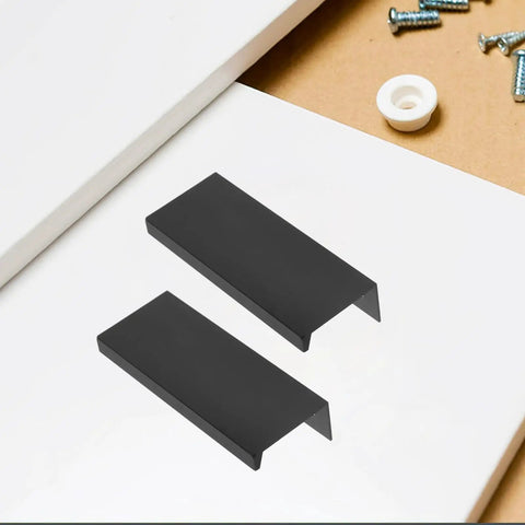 Slick Matte Black Recessed Cabinet Handles Edge Pulls for Sliding Doors and Drawers Hidden Flush Finger Pulls displayed on table