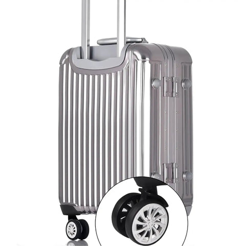 Silent And Smooth Rolling Luggage Wheel Replacement Kit Featuring Rock Solid Steel Axles With Super Flexible 360 Degree Swiveling Casters For Travel Gear Sets on silver suitcase with new black wheel