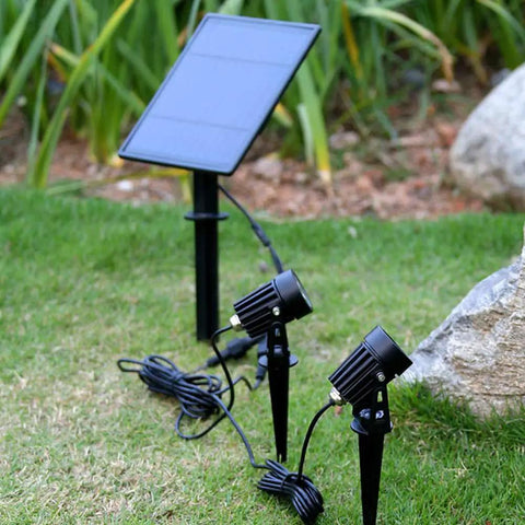 Metal Solar Spot Lights Outdoor With 9.8ft Cable Hella Bright 4 Spotlights on grass with solar panel, IP65 waterproof