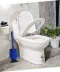 Heavy Duty Toilet Plunger Slays Stubborn Bathroom Clogs Quickly Without Breaking A Sweat Using Legit High Pressure Suction And Ergonomic Grip Handle next to a toilet in a modern bathroom.