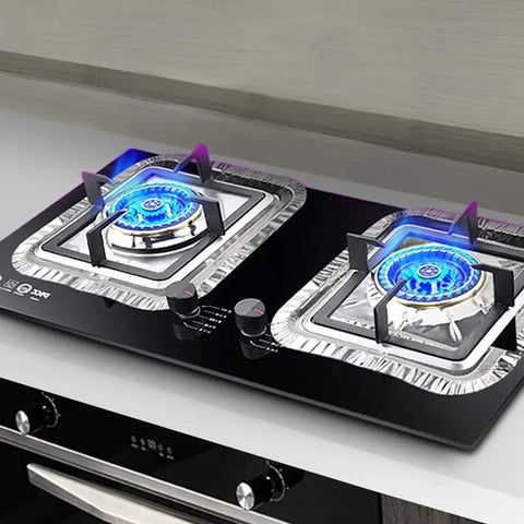 Disposable Stove Burner Liners Pack Of 50 Square 8.5 Inch Gas Rangetop Protectors on black cooktop with blue flame