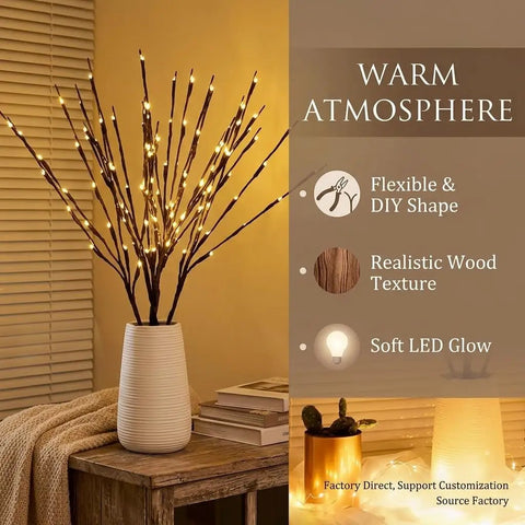 Two Pack Battery Operated LED Willow Branch Lights in vase with soft warm white glow on a wooden table.