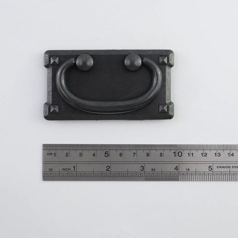 Close-up of Six Piece Matte Black Drawer Pulls with Backplates for Dresser and Cabinet Doors 3 inch center-to-center with ruler