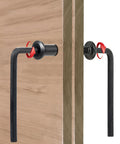 Close-up of 100-Piece M8x50mm Furniture Bolts Kit with black hex screws, barrel nuts through wooden boards showing tool in use.