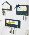 Slick Wall Mounted Wooden Coat Rack With Heavy Duty Hooks And Knockout Plaque Design Dang Neat Entryway Organizer For Keys Hats Robes Towels In Kitchen And Office Spaces on a wall.