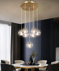 Sleek Modern Crystal Pendant Light With Seven LED Crystals, Adjustable Brass Plating Frame, K9 Crystal Ball Chandeliers in dining room