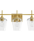 Three Light Vanity Light With Clear Glass Shades In Modern Gold Finish For Bathroom Over Mirror Contemporary Wall Lamp For Soft Balanced Lighting In Bathroom Bedroom Or Hallway, front view