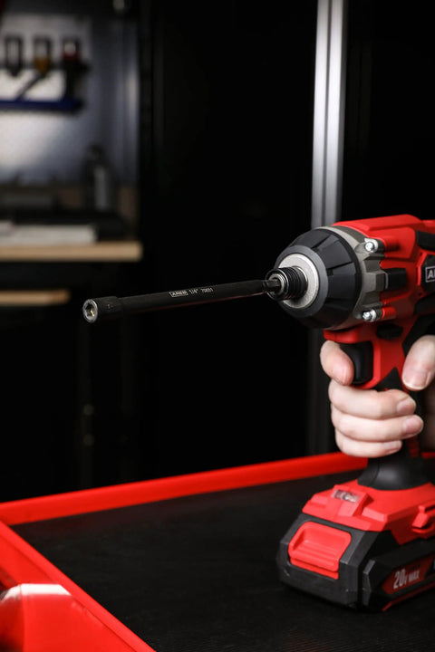 Power drill with Magnetic Impact Nut Driver Bit Set Three Piece 1/4 Inch Hex Shank Six Inch Length attached in workshop.