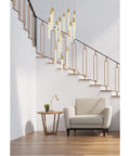 Top Shelf Modern Ceiling Pendant Light Featuring 16 Bright Crystal Accents In Sleek Satin Gold Finish For Killer Indoor Home Decor And Contemporary Room Makeover Vibes hanging above a cozy chair in a stylish living room.