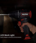 Hand holding Lightweight Brushless 12V Cordless Drill Kit With 310 Inlb Torque, LED Work Light on, drilling in dark space
