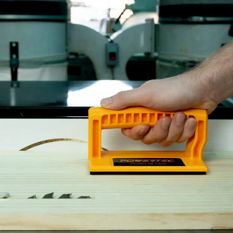 Hand using Magnetic Push Sticks And Push Blocks 5 Pack For Table Saw Router Table Band Saw And Jointer With Ergonomic Grips