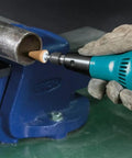 Heavy Hitter Quarter Inch Compact Die Grinder 28000 Rpm High Speed Rotary Tool with ergonomic grip working on metal tube.
