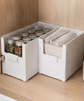 Versatile Big Capacity Heavy Duty Stackable Storage Bins Open Top Space Saving Closet Organizer With Slick Zero Hassle Design For Bedroom Bathroom And Kitchen Game Changer storing jars and cloths in a pantry.