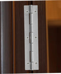 Installed silver continuous piano hinge on dark wood cabinet door with six screws.