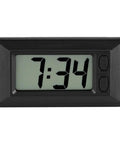 Ultra Thin Digital Clock With Wide Lcd Panel And Adhesive Mount For Car Dashboard Home Desk Ride Ready showing time 7:34 on clear display.