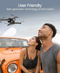 People watching HS360S Foldable GPS Drone With 4K UHD Camera for adults and newbies flying near an orange car.
