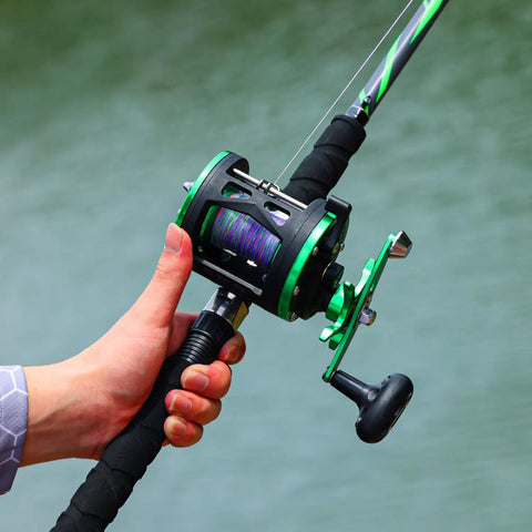 Progressive Glass Fishing Rod and Reel Combo 7ft Medium Heavy for Catfish Salmon and Steelhead Green Right Handed Reel in hand