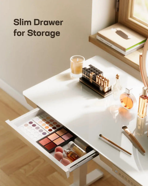Heavy Duty Glass Electric Standing Desk With Effortless Height Control For Compact Home Office Setup 35 X 20 Inch drawer displaying makeup and storage items.