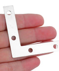 Heavy Duty L Shaped Corner Brackets For Woodworking Right Angle Metal Braces 100 Pcs Silver in hand close-up