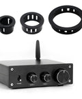 Image of 60 Pack 1/2 Inch Snap In Cable Bushing Grommets in black nylon, shown with electronic device for wires and hoses protection.