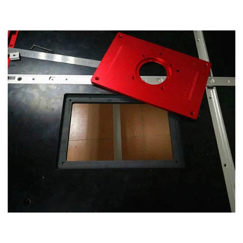 Solid As A Rock Aluminum Router Table Insert Plate Featuring Bullseye Center Bore For Rapid Wood Milling, red plate above cutout.