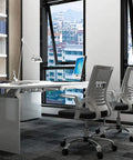 Modern office with gray chairs featuring 2 Inch Nylon Swivel Caster Wheel With Brake For Carts Office Chairs And Furniture.
