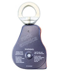 Back view of Omni-Block 2.0 Orange Swivel Pulley For Climbing And Rigging Systems with safety warnings visible.