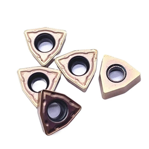 Heavy Duty Indexable Carbide Lathe Tool WCMT050308 cutting inserts in triangular shapes, suitable for CNC milling machining.