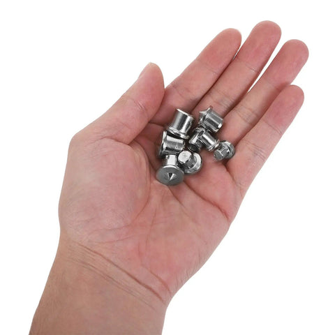 Hand holding 16 Piece Iron Dowel And Tenon Center Transfer Plugs Set For Precise Drilling In Tight Spaces Pro Grade Woodworking Alignment Pins