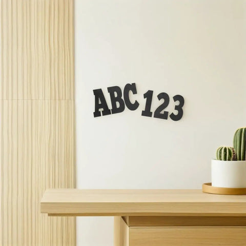 Six Sheets Black 4 Inch Outdoor Alphabet Decals Self Adhesive PVC Vinyl Letters For Signs Mailboxes And Dorm Doors Easy Peel And Stick Weatherproof Durable Outdoor Lettering Residue Free Repositioning DIY Ready on a white wall