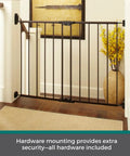 Bulletproof Hardware Mounted Walk Thru Pet Gate 31 Inches Tall Fits 28 To 48 Inch Doorways Displays A Slick Matte Bronze Finish, mounted at a stairway for safety.