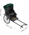 Retro Alloy Rickshaw Model Miniature Decor Showcasing Legit Vintage Charm And Dope Zinc Construction Perfect For Adding Cool Shelf Appeal Or Making A Solid Nostalgic Display Accent In Black, featuring green canopy and detailed wheels.