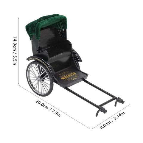 Retro Alloy Rickshaw Model Miniature Decor Showcasing Legit Vintage Charm And Dope Zinc Construction Perfect For Adding Cool Shelf Appeal Or Making A Solid Nostalgic Display Accent In Black, featuring green canopy and detailed wheels.