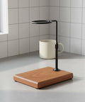 Premium Walnut Coffee Dripper Stand Adjustable Pour Over Holder with Matte Copper Aluminum Bracket and Textured Loop on countertop.