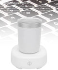 Smart Cooling Heating Mug Keeps Your Beverages Lit Or Properly Chilled On The Fly Auto Temp Control Stainless Steel Travel Cup with base on keyboard.