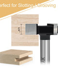 Pro Grade CNC Spoilboard Surfacing Router Bit 1 Quarter Inch Shank, 1 Inch Cutting Diameter, shown next to grooved wood plank