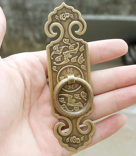 Two Pack Vintage Style Embossed Brass Drawer Pulls For Wardrobe Bookcase And Double Doors In Antique Bronze Finish in hand view
